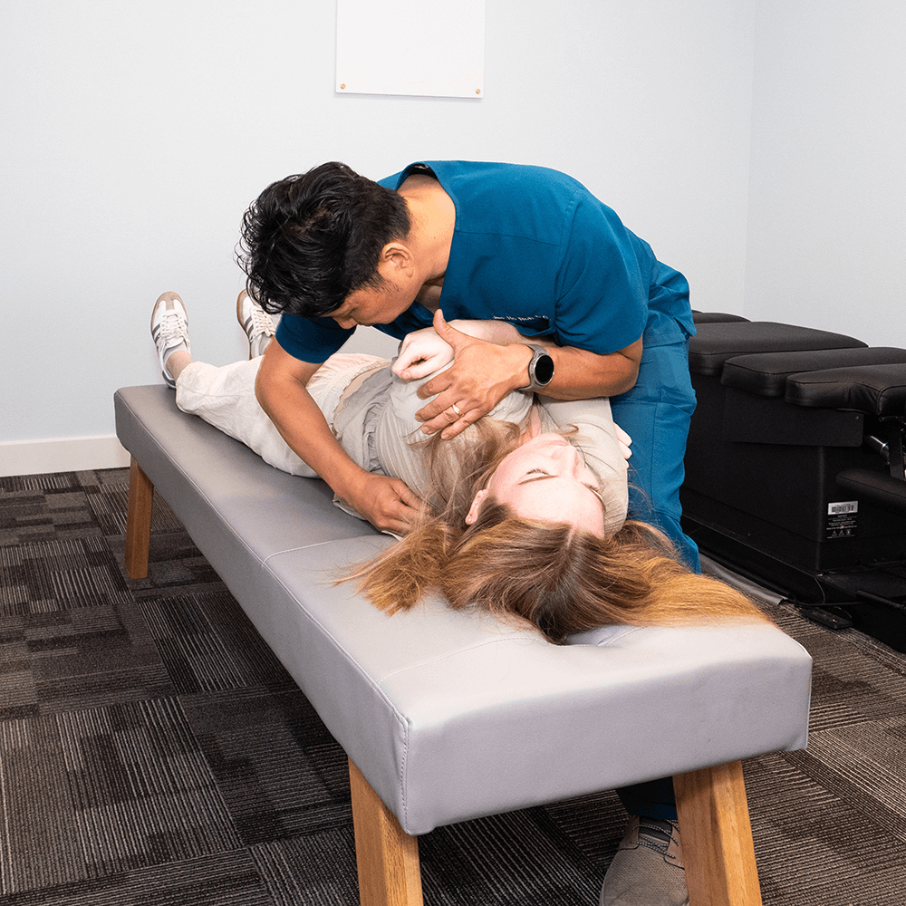 Jae ho Roh, D.C. giving patient back pain treatment